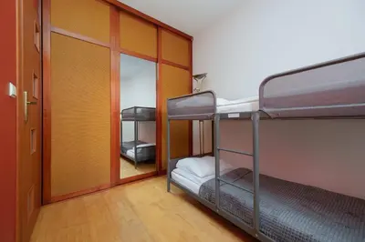 Łóżko lub łóżka w pokoju w obiekcie Family Apartment in Warsaw with Desk and Bathtub by Noclegi Renters