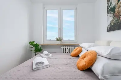 Łóżko lub łóżka w pokoju w obiekcie P&O Apartments Piwarskiego - Mokotów