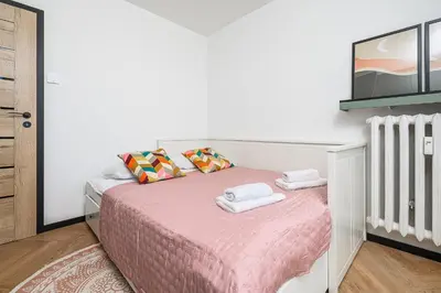 Łóżko lub łóżka w pokoju w obiekcie P&O Apartments Piwarskiego - Mokotów