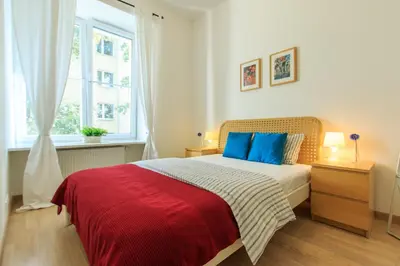Łóżko lub łóżka w pokoju w obiekcie Rental Apartments Wilcza