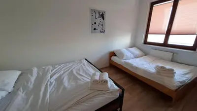 Łóżko lub łóżka w pokoju w obiekcie Bobrovia Apartment