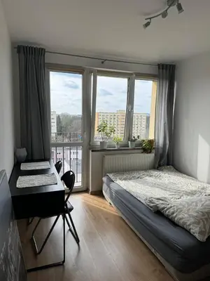 Łóżko lub łóżka w pokoju w obiekcie Pokój przy Rondzie Daszyńskiego