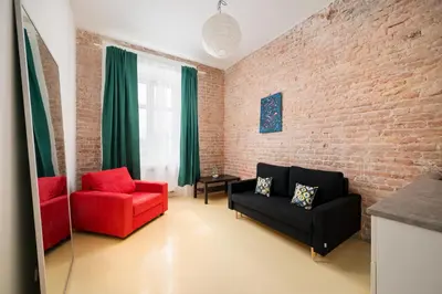 Część wypoczynkowa w obiekcie Wola Chic Studio with Mezzanine by BookingHost