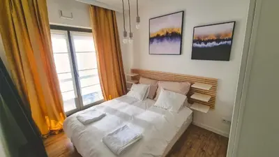 Łóżko lub łóżka w pokoju w obiekcie Duży apartament w sercu miasta