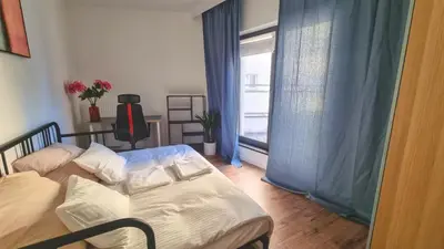 Łóżko lub łóżka w pokoju w obiekcie Duży apartament w sercu miasta