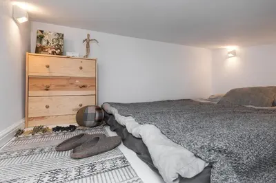 Łóżko lub łóżka w pokoju w obiekcie Boho Nest Warsaw - Cozy Studio