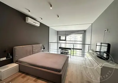 Łóżko lub łóżka w pokoju w obiekcie Qbik Apartments