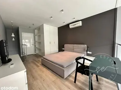 Łóżko lub łóżka w pokoju w obiekcie Qbik Apartments