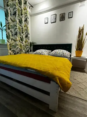 Łóżko lub łóżka w pokoju w obiekcie Powiśle Apartment