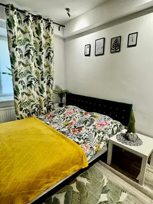 Łóżko lub łóżka w pokoju w obiekcie Powiśle Apartment