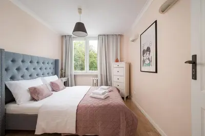 Łóżko lub łóżka w pokoju w obiekcie Afrykańska Deluxe Apartment by BookingHost