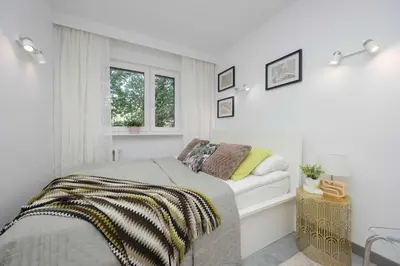 Łóżko lub łóżka w pokoju w obiekcie Nowoczesny Apartament w Zielonej Okolicy Czerniakowska by Noclegi Renters