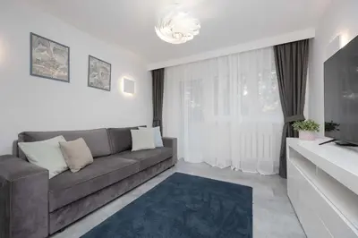 Część wypoczynkowa w obiekcie Nowoczesny Apartament w Zielonej Okolicy Czerniakowska by Noclegi Renters