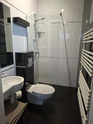 Łazienka w obiekcie KOMFORT NOCLEGI - delux&standard rooms
