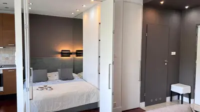 Łóżko lub łóżka w pokoju w obiekcie Apartament Mokotow