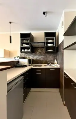 Kuchnia lub aneks kuchenny w obiekcie Cozy Stay Jana Pawła II Avenue Apartment