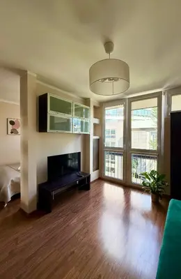 Telewizja i/lub zestaw kina domowego w obiekcie Cozy Stay Jana Pawła II Avenue Apartment