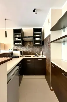 Kuchnia lub aneks kuchenny w obiekcie Cozy Stay Jana Pawła II Avenue Apartment