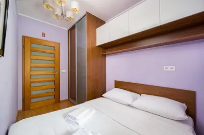 Łóżko lub łóżka w pokoju w obiekcie Namysłowska Cosy Apartment by BookingHost