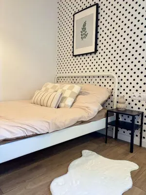 Łóżko lub łóżka w pokoju w obiekcie Elite 1-Bedroom Apartment in Central Warsaw by Mazowiecka