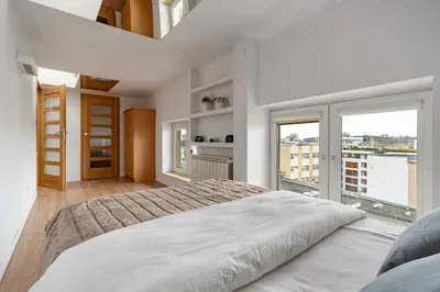 Łóżko lub łóżka w pokoju w obiekcie Large apartment in the center of Warsaw by P&M