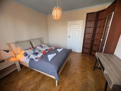 Łóżko lub łóżka w pokoju w obiekcie Murano Apartaments City View