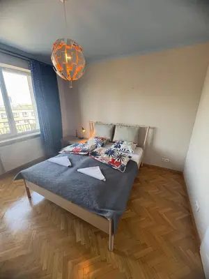 Łóżko lub łóżka w pokoju w obiekcie Murano Apartaments City View