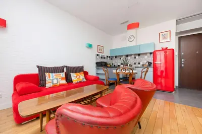 Część wypoczynkowa w obiekcie American Retro Apartment with Balcony Warsaw Powiśle by Noclegi Renters