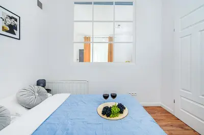 Łóżko lub łóżka w pokoju w obiekcie Lumina Charming 3-room apartment in the heart of Warsaw