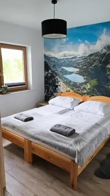 Łóżko lub łóżka w pokoju w obiekcie Cozy Apartment in Warsaw
