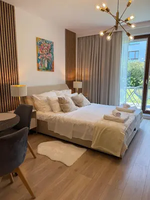 Łóżko lub łóżka w pokoju w obiekcie Apartment Miasteczko Wilanow Royal Wilanow