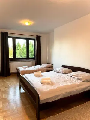 Łóżko lub łóżka w pokoju w obiekcie Hotel Familiar
