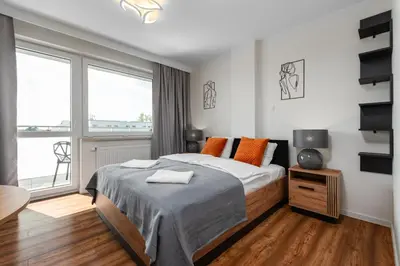 Łóżko lub łóżka w pokoju w obiekcie Pileckiego 59 by Homeprime