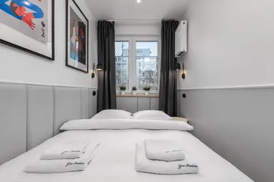 Łóżko lub łóżka w pokoju w obiekcie Apartamenty Pańska PREMIUM by Your Freedom