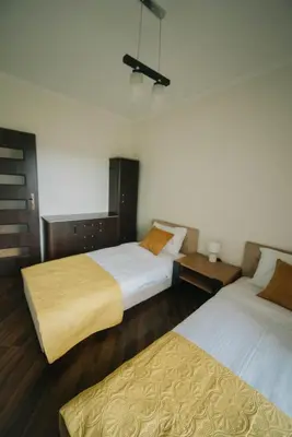 Łóżko lub łóżka w pokoju w obiekcie Etiuda Resident Apartment Mokotów, metro Służew