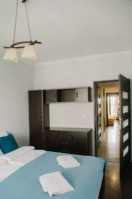 Łóżko lub łóżka w pokoju w obiekcie Etiuda Resident Apartment Mokotów, metro Służew