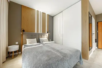 Łóżko lub łóżka w pokoju w obiekcie Apartament Wola Jana Kazimierza, WI-FI, Klima, Parking, Balkon, 29m2