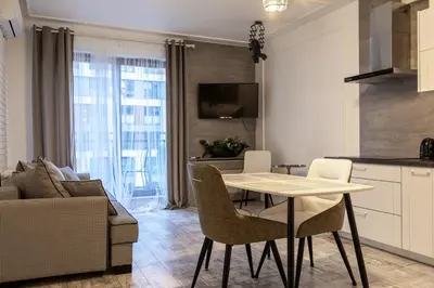 Telewizja i/lub zestaw kina domowego w obiekcie Modern Apartment with Balcony and Garage – Mokotów