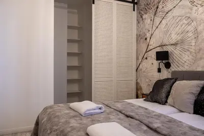 Łóżko lub łóżka w pokoju w obiekcie Modern Apartment with Balcony and Garage – Mokotów
