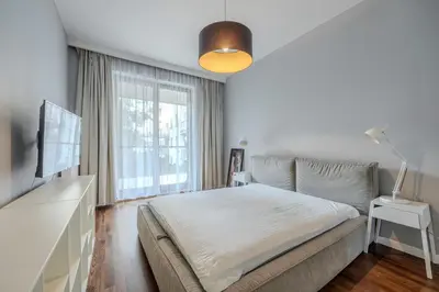 Łóżko lub łóżka w pokoju w obiekcie Apartament Klimczaka 22