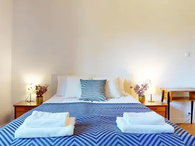 Łóżko lub łóżka w pokoju w obiekcie Greenview Apartment Zoliborz
