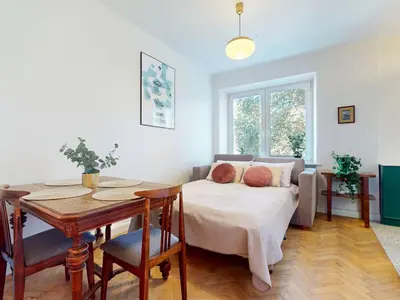 Łóżko lub łóżka w pokoju w obiekcie Greenview Apartment Zoliborz