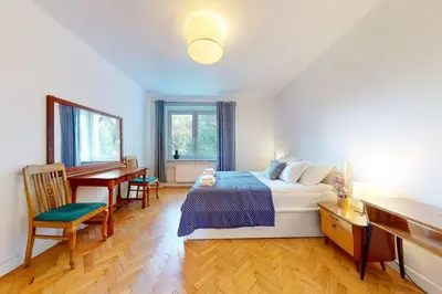 Łóżko lub łóżka w pokoju w obiekcie Greenview Apartment Zoliborz