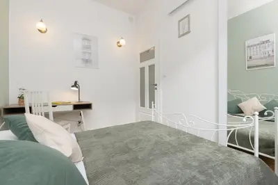 Łóżko lub łóżka w pokoju w obiekcie Stylowy Apartament dla 5 Osób Bartoszewicza by Noclegi Renters