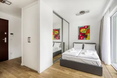 Łóżko lub łóżka w pokoju w obiekcie New Garden Apartments