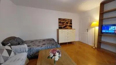 Telewizja i/lub zestaw kina domowego w obiekcie City Center Hollidays ROOM'S