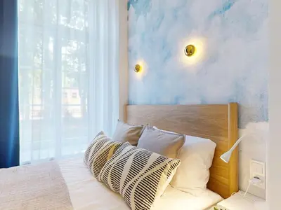 Łóżko lub łóżka w pokoju w obiekcie Elektoralna Premium Apartment City Center