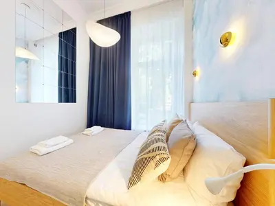 Łóżko lub łóżka w pokoju w obiekcie Elektoralna Premium Apartment City Center