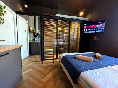 Łóżko lub łóżka w pokoju w obiekcie Loft Apartment Warsaw Centrum lok 4