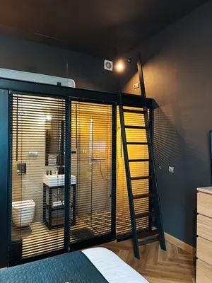 Łóżko lub łóżka w pokoju w obiekcie Apartment Loft Center Warsaw lok 1